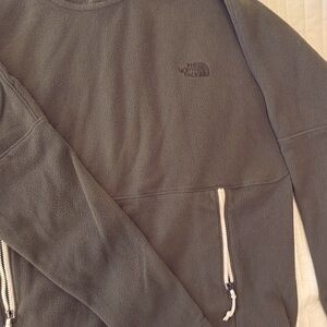 Olive green north face fleece hoodie with zip front pockets